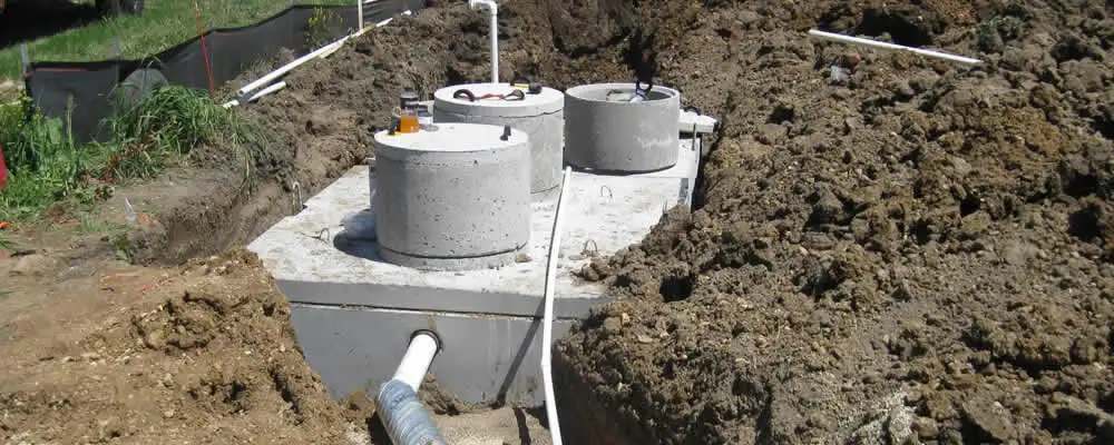 Septic system repair and installation site with tank access ports in Fresno, CA